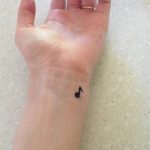 Music symbol wrist tattoo