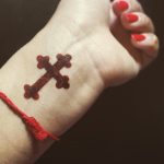 Unique cross wrist tattoo
