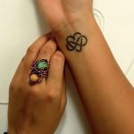 Love infinity tattoo on wrist